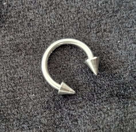 Silver spike horseshoe curved barbell septum ring. 16G. 8mm diameter. Stainless steel. Externally threaded Spiked Septum Piercing, Septum Piercing Jewelry, Septum Jewelry, Septum Piercing, Piercing Jewelry, Septum Ring, Piercings, Nose Ring, Money