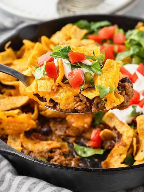 If you're looking for a quick and easy meal that’s a real crowd-pleaser, Walking Taco Casserole is the perfect choice. It’s got all the cheesy flavor of a walking taco, but it's made in a cast iron skillet in just 30 minutes! Walking Taco Casserole, Walking Taco, Walking Tacos, Taco Casserole, Iron Skillets, Cast Iron Skillet, Crowd Pleaser, Iron Skillet, Skillet