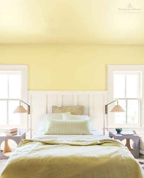 Bring new life to a small or dim #room with Beacon Hill Damask HC-2, an effervescent yellow with a hint of lime from the Benjamin Moore Color Trends 2021 palette. #ColorTrends2021 . (UPPER WALL & CEILING) Beacon Hill Damask HC-2, Regal® Select, Eggshell (TRIM & WAINSCOTING) Atrium White OC-145, Regal® Select, Semi-Gloss Yellow Bedroom Paint, Benjamin Moore Yellow, Painted Wainscoting, White Wainscoting, Dark Paint Colors, Paint Colors Benjamin Moore, Benjamin Moore Colors, Yellow Bedroom, Beacon Hill