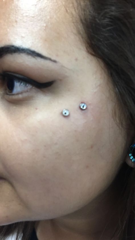 Double eye dermals Double Dermal Piercing Face, Dermal Cheek Piercing, Double Dermal Piercing, Cheekbone Dermal, Cheek Dermal Piercing, Dermal Piercing Face, Eye Dermal, Face Dermal Piercing, Face Dermal