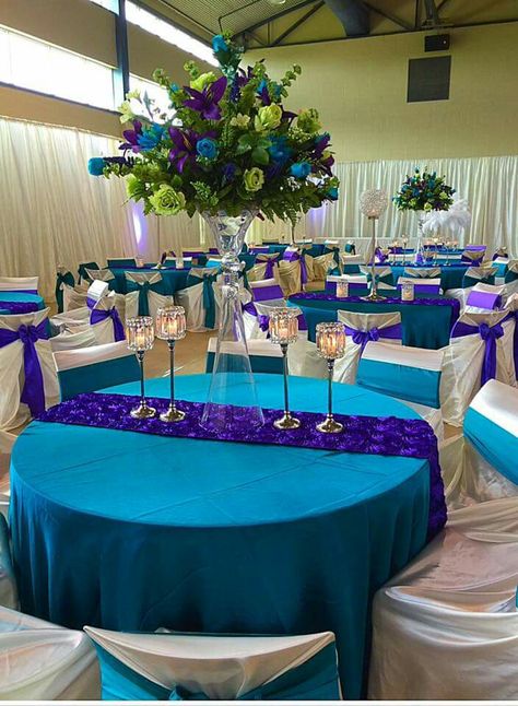 Purple and aqua decor Peacock Wedding Table Decor, Teal And Purple Quinceanera Ideas, Peacock Wedding Theme Decorations, Purple And Blue Party Ideas, Purple And Aqua Wedding, Turquoise And Purple Wedding Decorations, Teal And Purple Wedding Decorations, Purple Turquoise Wedding Reception, Purple And Turquoise Wedding Ideas