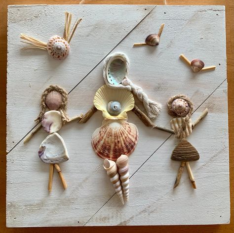 Custom Made to Order  This handcrafted coastal wall art hanging is designed using unique finds from North Carolina beaches. Seashells and nautical rope form a grandmother or mother with two daughters. (Sons available upon request.) Two seagulls fly above the trio of shell people.  Each order will vary in shell shapes and sizes, as each design is unique. Rope hair will be as similar as possible, while maintaining the style and beauty of the original design.  This seashell people wall art hanging Mother With Two Daughters, Seashell People Sea Shells, Shell Shadow Box Ideas, Shell People Art, Seashell Friends, Diy Seashell Crafts Vacation Memories, Sea Shell Keepsake Vacations, Seashell People, Shell People