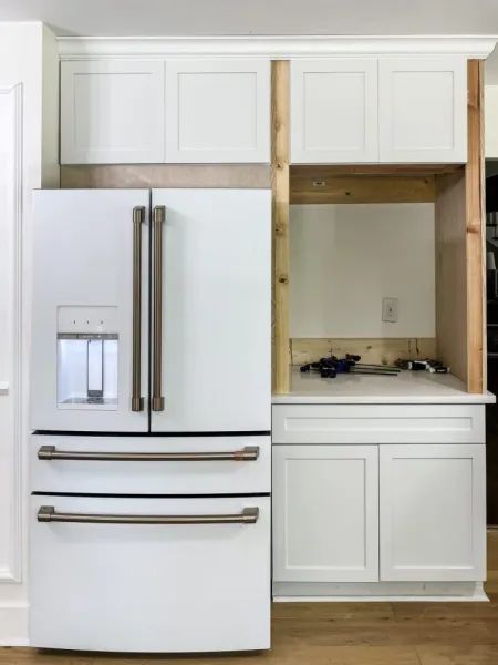 building a fridge enclosure Awkward Refrigerator Placement, Standard Depth Fridge In Kitchen, Fridge In Corner Of Kitchen, Fridge With Pantry Surround, Built In Refrigerator Ideas, Fridge Enclosure, Fridge In Kitchen, Hidden Refrigerator, Built In Fridge