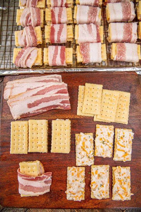 Crack Bacon Crackers Recipe – These things fly off the plate at parties! Super easy to make with only 5 ingredients! Club crackers, cream cheese, ranch dressing mix, cheddar cheese, and bacon. Can make 10 or 100. Can assemble ahead of time and bake when ready. A bacon lover's dream! This bacon cracker recipe makes a great appetizer, breakfast snack, tailgate dish, and party food. You are going to love them! Candied Bacon Crackers With Cream Cheese, Bacon Parmesan Crackers, Bacon Wrapped Club Crackers Parmesan, Bacon Crackers Appetizers, Bacon Wrapped Club Crackers, Bacon Crackers Brown Sugar, Ritz Snacks, Bacon Wrapped Crackers, Dance Snacks