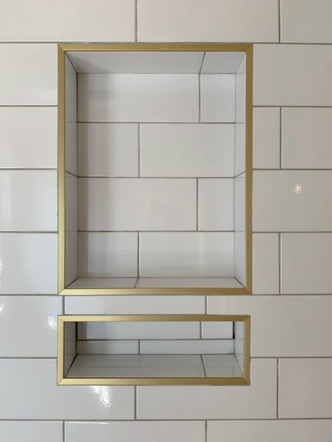 Bathroom Tile Gold Accents, Schluter Trim Bathroom, Gold Shower Niche, Jack And Jill Bathroom Renovation, Schluter Shower Niche, Niche Ideas Bathroom, Gold Trim Bathroom, Gold Tile Trim, Shower Niche Trim