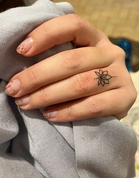 Ohm Finger Tattoo, Female Finger Tattoos, Lotus Finger Tattoo, Ring Finger Tattoo For Women, Finger Ring Tattoo, Tattoo Designs Finger, Tattoos For Women Finger, Flower Finger Tattoos, Ring Finger Tattoo