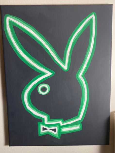 Black painted canvas with a playboy bunny logo in a neon green styled painting. Nein Paintings, Neon Style Painting, Black Spray Paint Ideas, Cute Mini Canvas Paintings For Boyfriend, Diy Neon Sign Painting, Y2k Canvas Painting Easy, Neon Painting Ideas On Canvas, Neon Painting Canvas Easy, Neon Drawings Easy