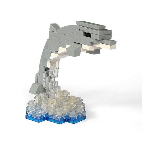 So Long And Thanks For All The Fish | The Brothers Brick | LEGO Blog Lego Movie Sets, Lego Creatures, Lego Zoo, Lego Ornaments, Dolphin Sculpture, Dolphin Party, Brick Lego, Lego Juniors, Custom Puppets