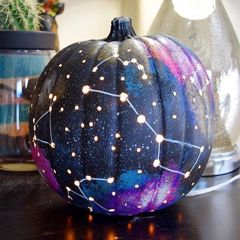 Looking for a fun pumpkin craft? How about a galaxy pumpkin complete with lit up constellations? It's so much fun! Get the details on the blog. #madewithmichaels Night Sky Pumpkin Painting, Galaxy Pumpkin, Starry Night Pumpkin, Cauldron Painted Pumpkin, Celestial Painted Pumpkins, Cool Pumpkin Designs, Pumpkin Decorating Diy, Diy Halloween Dekoration, Halloween Decor Diy