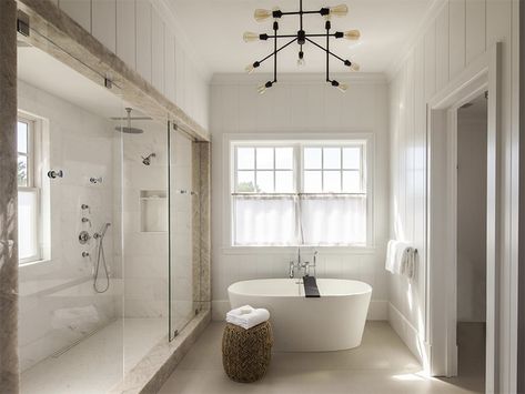 A polished gold table in the center of a weathered wood alcove make a bold statement in a modest kitchenette. Tub Lighting, Slipper Tub, Rustic Bath, Minimalist Bathroom Design, Refinish Bathtub, White Tub, Freestanding Tub, Hamptons House, Chic Bathrooms