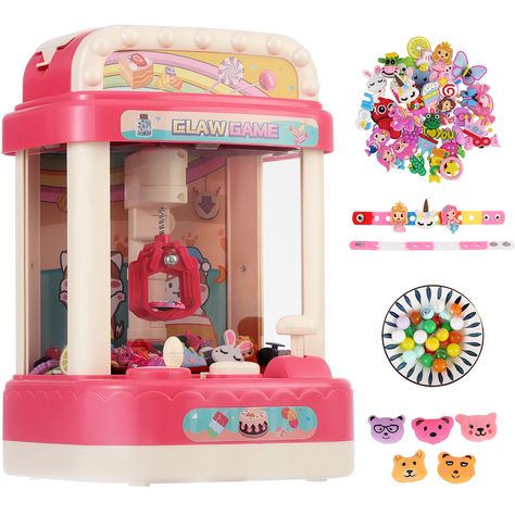 PRICES MAY VARY. Over 50 Mini Toys For Prizes - You can refill this small electronic claw machine with 50 croc charms toys & 2 bracelets (included), candy (not included), or snacks (not included). Your kid can play with the crane claw machine play set to grab his/ her prizes at home. Great Toy Gift to Kids - Your grand kid or your kid will be very happy to receive this cool musical arcade claw machine as his/her birthday gift or Christmas gift. The dimension of this toy is ‎8 x 7.7 x 4 inches. F Arcade Claw Machine, Candy Crane, Claw Crane, Claw Game, Crane Game, Mini Arcade, Easter Party Favor, Mini Toys, Egg Toys