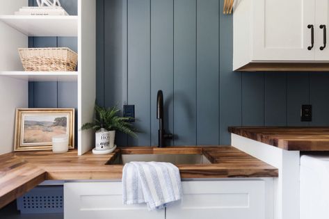 Smoky blue walls, bright white cabinets and butcher block countertops star in this stylish laundry room remodel Before And After Laundry Room, Build Laundry Room, Blue Laundry Room, Kitchen Upgrade Ideas, Tiny Galley Kitchen, Walnut Butcher Block Countertops, Small Utility Room, Blue Laundry Rooms, Wooden Worktops