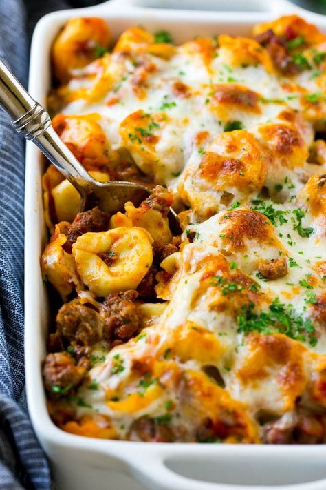 A pan of baked tortellini in a meat sauce, all covered with cheese. Tortellini Taco Bake, Rainbow Tortellini Recipes, Tortalini Casserole Recipes, Frozen Cheese Tortellini Recipes, Frozen Tortellini Recipes, Dinner At The Zoo Recipes, Baked Tortellini Recipes, Easy Tortellini Recipes, Frozen Tortellini