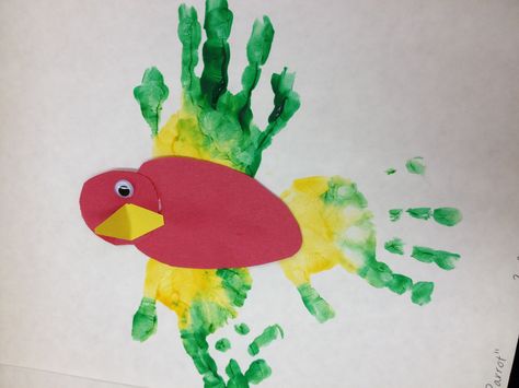 Parrots with handprint feathers---this was a  last minute idea that turned out a beautiful result! Preschool Rainforest, Pirate Ideas, Footprint Craft, Footprint Crafts, Parrots Art, Daycare Ideas, Daycare Activities, Holiday Crafts For Kids, Class Room