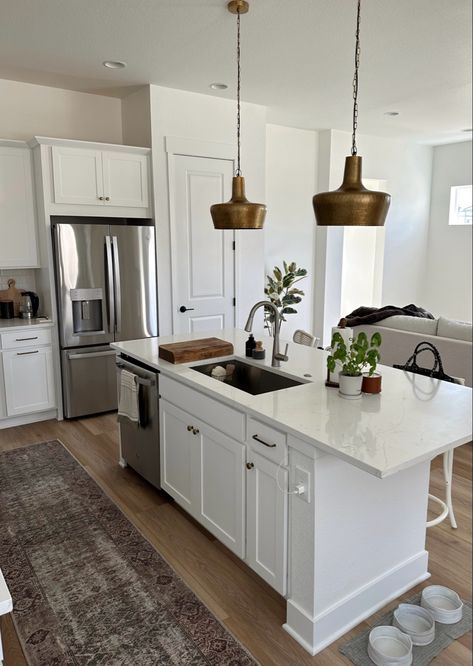 White Kitchen With Antique Brass Hardware, White Organic Modern Kitchen, Antique Brass Kitchen Hardware White Cabinets, Lvp Flooring Kitchen, Brass Kitchen Hardware White Cabinets, Amber Lewis Rug, White Cabinets Brass Hardware, Brass Kitchen Pendants, Antique Brass Kitchen Hardware