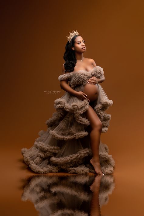 Gorgeous queen poses in a tan ruffle gown with a crown in stunning maternity photoshoot with water reflection Maternity Shoot Dresses, Maternity Photography Dress, Maternity Shoot Outfit, Maternity Picture Outfits, Beautiful Maternity Dresses, Cute Pregnancy Pictures, Maternity Photography Poses Couple, Maternity Photography Poses Pregnancy Pics, Couple Pregnancy Photoshoot