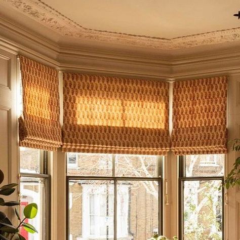 The Hackney Draper on Instagram: "How gorgeous are these blinds in a bay?! Using a beautiful hand block print from Les Indiennes, here offering shading to the living room whilst letting the light still warm the room. Romans work super well in bay windows as a great alternative to curtains. Thanks to our lovely client for letting us pop back and share! 🧡
 
#romanblinds #baywindow #thehackneydraper #thehackneydraperbespoke #interiorsinspo" Bay Window Roman Blinds, Alternative To Curtains, Bay Window Blinds, Curtain Alternatives, Pop Back, Bay Windows, Hand Block Print, Roman Blinds, Blinds For Windows