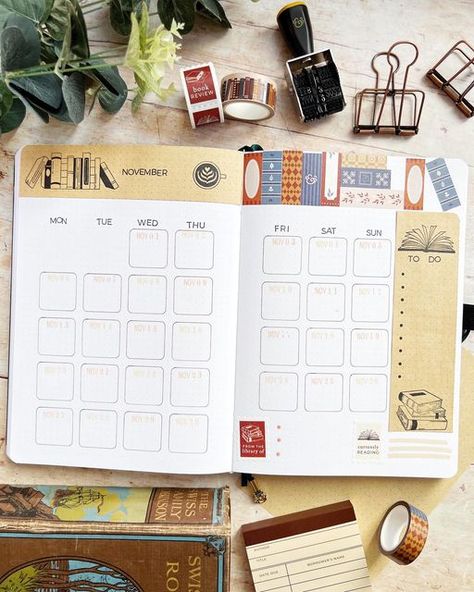 Alex | Bullet Journal Ideas & Stationery Love on Instagram: "📖 November Monthly Log ☕️ Here is my coffee and books themed calendar for the month. ⇨ Swipe to see in more detail ⇦ I loved using the @archerandolive rolling date stamp for each day. Did you spot there was a blank year on it so you could easily just make it a month-day format? The washi here was also from the vintage library box. I have cut it to hopefully look like book spines on a shelf! This monthly layout didn’t take too long using a stencil from @oopsadaisyuk too. Thank you for all the love on this theme! Follow @thejournalcorner to see more for November. #aoshare #archerandolive #bulletjournal #bujo #bulletjournaling #bujoideas #bulletjournalideas #bujoinspo #bujoinspiration #bulletjournallove #bujobeauty #buj Journaling November, 2024 Bujo, Book Spines, Monthly Layout, Date Stamp, Bullet Journal Ideas, Book Spine, Vintage Library, Bullet Journal Themes