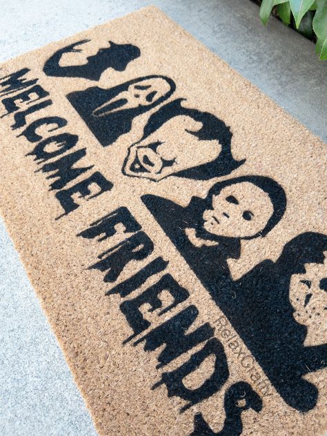 Horror Friends DoormatOur mats are made of 100% natural coir material with PVC slip resistant rubber backing. Natural surface provides durability and traction to wipe your shoes. Suitable for indoor and outdoor use.All of our designs are hand-painted made with love just for you.We use high quality, water resistant outdoor paints and UV Sealed for durability. Halloween Rug Stencil, Halloween Mat Stencil, Halloween Outdoor Mat, Halloween Welcome Mats Diy, Halloween Floor Mat, Hand Painted Door Mats, Halloween Doormat Ideas, Halloween Rugs Diy, Halloween Door Mat Diy