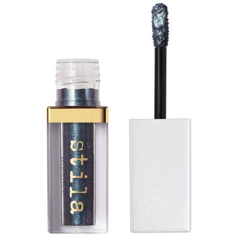 Marrying a twinkling blend of high pigment and micro-fine glitter particles, the Stila Glisten and Glow Liquid Eyeshadow delivers a pearlescent, multi-dimensional metallic finish. The light-catching liquid shadow accentuates the eyes with an ultra-glowing, water-infused formula that glides on with a quick dry-down time.  Designed to offer an effortless application, the shimmering eyeshadow is equipped with a soft brush applicator, to smooth directly onto the lids for the ultimate glow and minima Shimmering Eyeshadow, Glowing Water, Liquid Eye Shadow, Liquid Shadow, Grande Cosmetics, Multi Dimensional, Spa Essentials, Liquid Eyeshadow, Shea Moisture Products