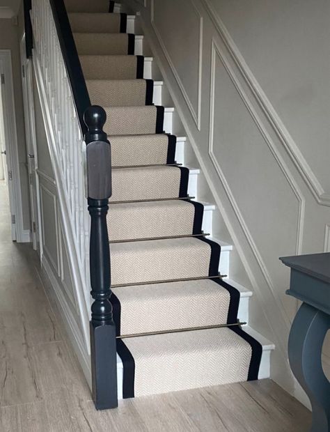 Stair runners are often MUCH cheaper then a full carpet on the staircase and when paired with cast iron rods, add a beautiful Victorian London look! An essential cheap upgrade for upstairs flats! Hallway With Stair Runner, Pine Staircase Makeover, Staircase Entryway Ideas Small, Hallway Bannister Ideas, Stair Runner Black Trim, Black Stairs Runner, Stair Runner Bars, Staircase Makeover With Runner, Black And White Staircase With Runner