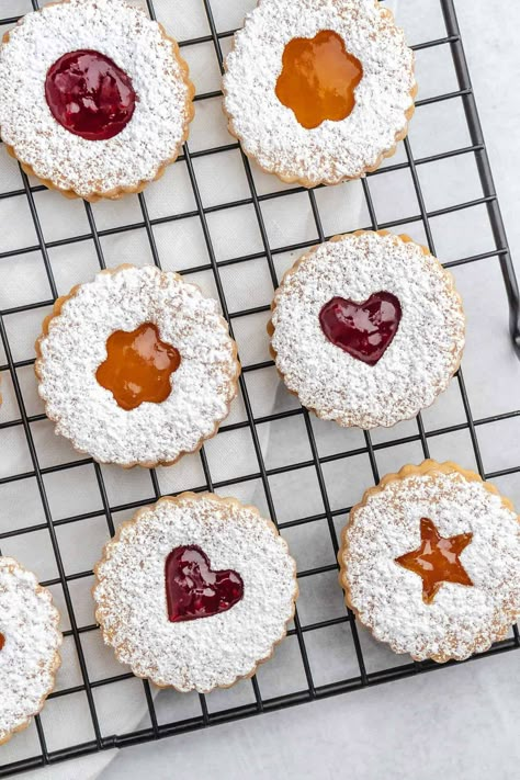 These classic dairy-free Linzer Cookies are the perfect balance between sweet and tart, an essential addition to the holiday season. This simple recipe is nut-free, so everyone can enjoy it! Lenten Desserts, Linzer Tart Cookies, Vegan Christmas Cookies Recipes, Vegan Holiday Cookies, Vegan Butter Chicken, Easy Vegan Cookies, Linzer Cookies Recipe, Christmas Cookies Recipes, Vegan Christmas Cookies