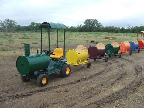 Childrens Barrel Train Cars, by S. Elkins by MillerWelds.com, via Flickr Tractor Playground, Barrel Train Cars, Outdoor Monster Truck Track, Wooden Train Playground, Toy Train Accessories, Barrel Train, Homemade Go Kart, Barrel Projects, 55 Gallon