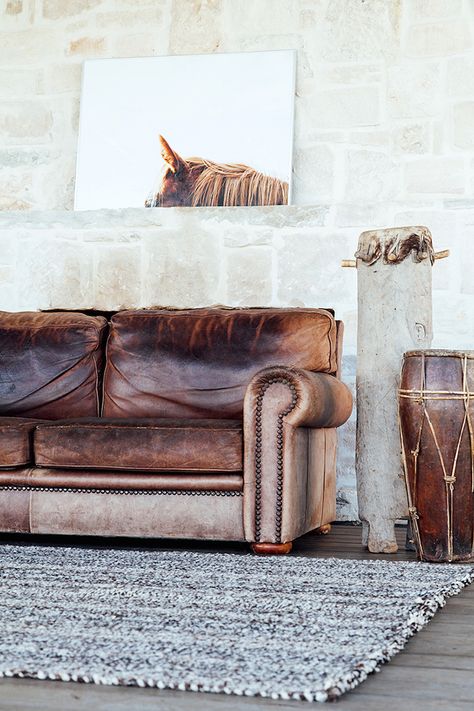 Distressed brown leather sofa with drums Distressed Leather Couch, Leather Furniture Decor, Tan Leather Sofas, Brown Leather Couch, Living Room Wood Floor, Leather Living Room Furniture, Rustic Living Room Furniture, Brown Leather Sofa, Trendy Living Rooms