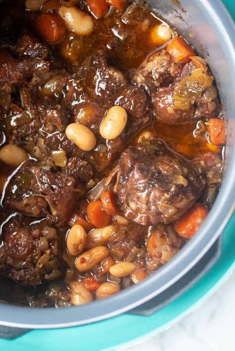 This Jamaican Oxtail recipe is the perfect Caribbean stew for dinner. Delicious and tender oxtail and butter beans that is cooked to perfection. Make it in the Instant Pot or any electric Pressure Cooker. Slow cooker instructions also included. #jamaicanoxtails #oxtailstew #pressurecookerrecipe #instantpotstew #authenticjamaicanoxtail #caribbeanrecipes Oxtail Recipes Crockpot, Jamaican Oxtails, Oxtail Recipes Easy, Oxtails Recipe, Jamaican Oxtail Stew, Cooking Oxtails, Oxtail Recipe, Jamaican Oxtail, Oxtail Stew