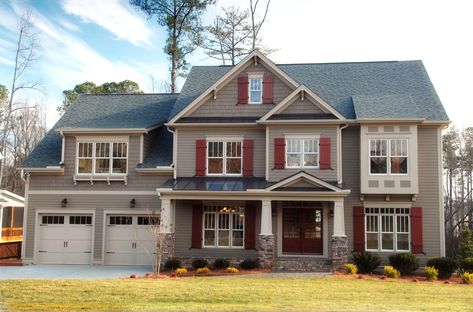 Here's an example of a newer style suburban home with exterior shutters. I really think black or dark gray shutters would look much better than the red here. It's not that I don't like red shutters; it's just that I don't think red works the best with the light brown exterior. Best Front Door Colors, Window Shutters Exterior, Red Shutters, Tan House, Different House Styles, Shutter Colors, House Shutters, Exterior House Color, Brown House