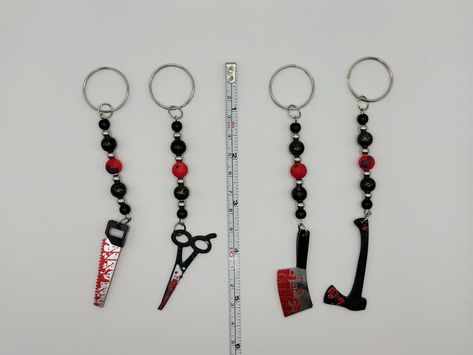 🔪🩸 The Perfect Killer Keychain! Looking for the ultimate spooky accessory? Our Bloody Weapon Keychains are here to slash their way into your collection! Would you prefer an axe, saw, knife, or scissors? 🎃 These chilling keychains are the perfect match for our Bloody Knife Earrings! ❤️‍🔥 Choose Your Weapon: Axe 🪓 Saw 🪚 Knife 🔪 Scissors ✂️ All come with a silver-colored key ring and are just under 5.5 inches long. The perfect horror-inspired duo for your keys or bags! 🖤🔪 🎁 Plus: Fre... Trinket Keychain, Knife Earrings, Handmade Keychains, Key Ring, Key Rings, Perfect Match, Keychains, Key, Ring