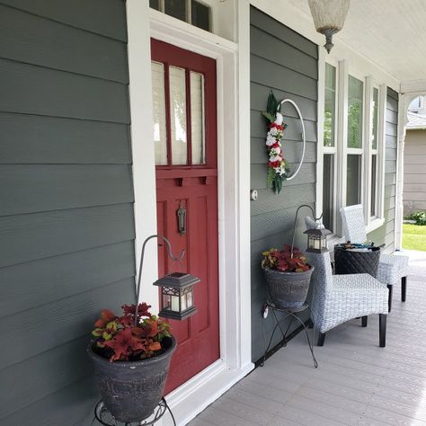 Gunmetal Gray siding, white trim, and red door (door color called passionate) Grey Siding Door Color, Blue House Red Door White Trim, Red Door House Exterior, Door Colors For Gray House With Black Shutters, Exterior House Colors Red Door, Red Door Exterior House Colors, Dark Gray House Red Door, Exterior House Colors With Red Doors, Red Door Porch Decor