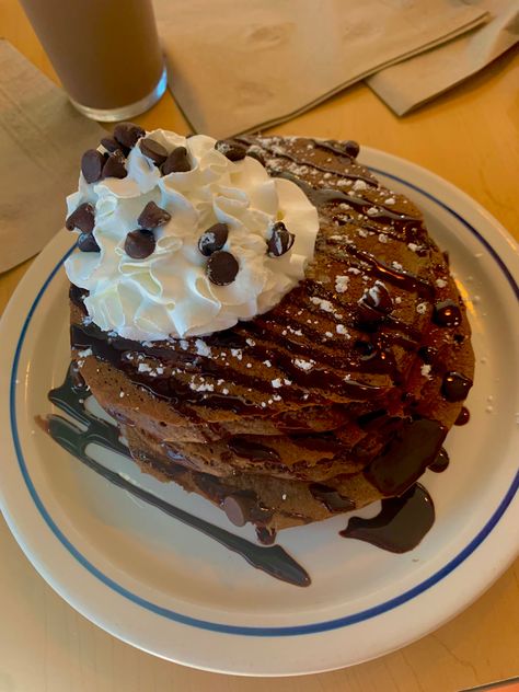 Chocolate chip pancakes topped with whip cream and chocolate chips and chocolate syrup Chocolate Chip Pancakes Aesthetic, Ihop Pancakes Aesthetic, Ihop Chocolate Chip Pancakes, Pancakes Ihop, Ihop Food, Ihop Breakfast, Chocolate Chip Pancake, Pancakes Chocolate, Ihop Pancakes