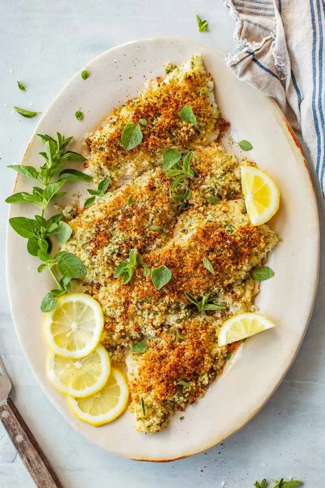 This quick and easy recipe for Baked Flounder Oreganata is a classic Italian dish that's surprisingly simple to prepare at home. Delicate flounder fillets get topped with lemony, garlic-infused breadcrumbs for a restaurant quality seafood dinner that's as perfect for weeknights as it is for special occasions. | ColeyCooks.com Oreganata Recipe, Easy Fish Dinners, Flounder Fillet, Flounder Recipes, Classic Italian Dishes, Cooking Seafood, Italian Recipes Authentic, Seafood Dinner, Authentic Recipes