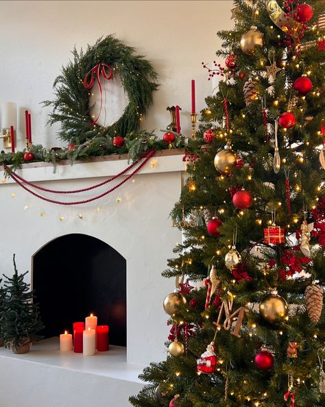 🔴✨Red and gold!✨🔴 That’s it! My tree is complete! No beads or bows (I do have a gold one at the top) on the tree this year. No candle sticks or florals. Just a few berries and ornaments for an old fashioned trad tree! Swipe to see some twilight views! #kingofchristmas #christmastreedecorating #christmastreedecor #christmasmantle #traditionalchristmas #valerymadelyn #valerymadelynchristmas Red And Gold Christmas Tree, Red And Gold Christmas, Christmas Mantle, Candle Sticks, Gold Christmas Tree, Gold Christmas, Red And Gold, Christmas Traditions, The Tree