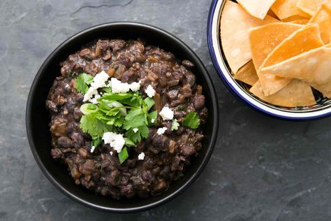 Love refried beans? Give refried black beans a try! Start with canned or dried black beans, then fry and mash them with savory seasonings. This'll be your new go-to recipe for refried beans. Refries Black Beans Recipe, Refried Black Beans Recipe, Recipe Black Beans, Black Bean Dip Recipe, Refried Black Beans, Black Beans Recipe, Refried Beans Recipe, Bean Dip Recipes, Black Bean Dip