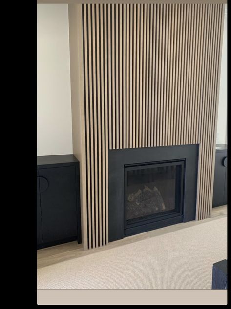 Slatted Wood Fireplace, Wood Plank Fireplace Wall Living Room, Slat Wall Alcove, Wall Slat Fireplace, Wood Slat Fireplace Surround, Panelled Fireplace Wall With Tv, Wood Slat Accent Wall Fireplace, Vertical Wood Slat Fireplace, Fireplace With Wood Slats