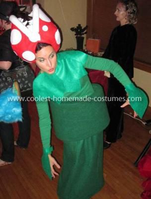 Homemade Piranha Plant from Mario Bros Costume: The Homemade Piranha Plant from Mario Bros Costume is a great costume for anyone! It's an unexpected yet beloved Mario Bros character that's guaranteed Mario Plant Costume, Birdo Mario Costume Diy, Unique Mario Costumes, Toadstool Costume Mario, Diy Mario Character Costumes, Mario Characters Costumes, Pirhana Plant Costume Mario, Piranha Plant Costume, Nintendo Halloween