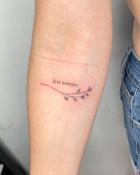 "Just breathe" and flowers tattoo located on the inner Typewriter Font Tattoo, Font Tattoos, Community Tattoo, Just Breathe Tattoo, International Tattoo, Small Heart Tattoos, Petite Tattoos, Tattoo Font, Typewriter Font