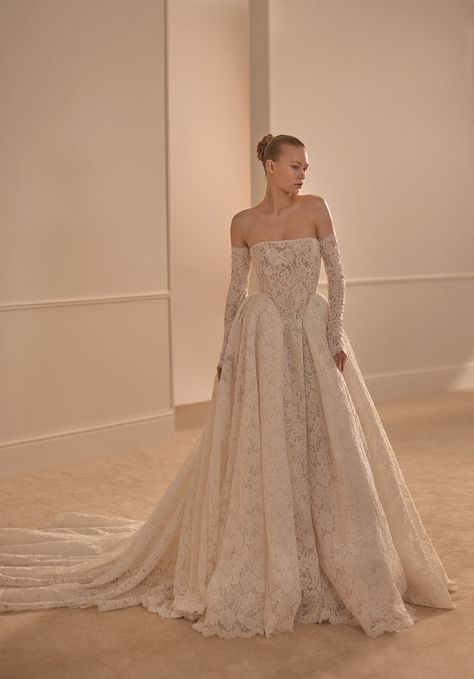 The new Jade gown with long lace sleeves. Regal lace ball gown featuring a strapless, straight-across neckline, built-in corset with a basque waist, detached long sleeves, and full skirt boasting a sweeping train. #lihihod #luxurybridal #bridalgown #weddingdress #coutureweddingdress #bride2025 #bridalfashion #gardenwedding Wedding Dresses 2024 Trend New, Designer Wedding Gown, Lihi Hod, Chic Prom Dresses, Contemporary Bridal, Fairy Tale Wedding Dress, Couture Wedding Gowns, Dress Alterations, Dream Wedding Ideas Dresses