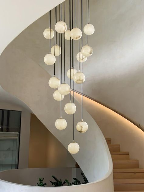 The Alabaster Balls Cluster Chandelier is a modern masterpiece, designed to add a touch of divine elegance to your space. Featuring a series of glowing Alabaster Balls suspended in a layered formation on a smooth circular canopy, each of the orbs is meticulously crafted to exude a soft ambient glow cascading down in an elegant array. With its delicate design, this cluster chandelier is a centerpiece in any room, perfect for creating a refined and peaceful atmosphere. Whether illuminated or not, Feature Lighting Pendant, Modern Organic Chandelier, Cluster Chandelier, Alabaster Lamp, Chandelier Modern, Kitchen Lighting Fixtures, Kitchen Pendants, Chandelier Design, Creative Furniture