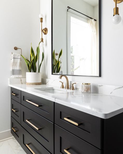 Step in to luxury with this modern bathroom! 🛁 Picture black custom-built cabinets, charming gold accents, and the warm glow of modern sconces. Add the touch of luxury with marble countertops and flooring for a space that's as inviting as it is stylish!✨ 


Builder @restorebuildanddesign 

Design @hawkinsandgraydesign 

Photo @lyndseymariephotography 

 

@breannagriswoldsdesigns 

@klaserandco 

@christinahalldesigns 

@hawkinsandgray_organizing 

Cabinetry @luxecabinetryanddesign Beige Countertops Bathroom, Black Bathroom Countertops, Custom Built Cabinets, Bathroom Picture, Black Counters, Bathroom Remodels, Bathroom Counters, Bathroom Countertops, Modern Sconces