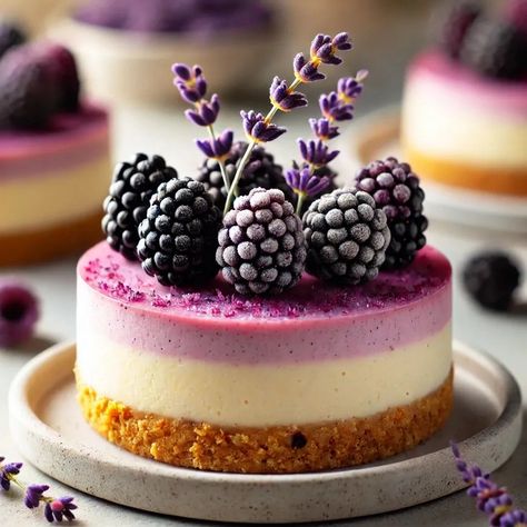 💜 Luscious Blackberry Lavender Cheesecakes 💜🤍 These elegant Blackberry Lavender Cheesecakes are the perfect blend of floral and fruity flavors! Creamy lavender-infused cheesecake meets a sweet and tart blackberry topping, all nestled in a buttery graham cracker crust. Perfect for any special occasion or a fancy treat just for you! Ingredients: For the Crust: 1 cup graham cracker crumbs 🍪 1/4 cup unsalted butter, melted 🧈 2 tablespoons sugar 🍬 For the Cheesecake: 16 ounces cream cheese, s... Blackberry Topping, Layered Cheesecake, Blackberry Lavender, Layer Cheesecake, Early Grey, Cracker Crust, Graham Cracker Crust, Graham Cracker Crumbs, Graham Cracker