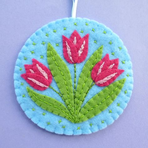 First daffodils, then tulips! 🌷🌷🌷 Another one of my spring flower embroidery patterns turned into a felt ornament. Fingers crossed I can find the time (and focus!) this month to get the patterns and tutorials for these ready to share 🤞 Felt Tulip Pattern, Tulip Embroidery Pattern, Spring Flower Embroidery, Sewing Tulips Flower, Felt Tulip, Tulips Applique Pattern, Embroidered Tulips, Laura Howard, Felt Ornament