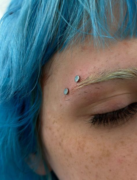 TAKE A PEEK AT THIS DERMAL PIERCING ON THE EYEBROW BY @marcymods Soho, Union Square, and Williamsburg 11AM-9PM 7 DAYS A/W🕘 WALK-INZ OR BOOK ONLINE..📕 TATTOOS & PIERCINGS, NO ATTITUDE, NO MISERABLE HOOPS TO JUMP THROUGH....🚫 WALK-INZ WELCOME OR BOOK ONLINE AT ⚔️livebytheswordtattoo.com⚔️ . . . . #surfacepiercing #dermalpiercing #bodymodification #piercer #soho Dermal Eyebrow Piercing, Eyebrow Dermal Piercing, Septum And Eyebrow Piercing, Dermal Under Eye Piercing, Anti Eyebrow Piercing Dermal, Face Dermal Piercing Eye, Dermal Piercing And Tattoo, Dermal Pericing Back, Surface Piercing