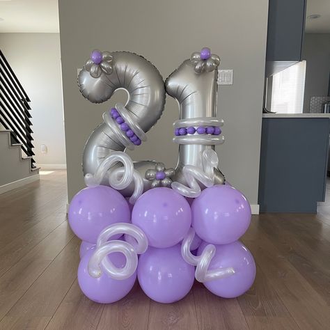 A “21” silver foil balloon sitting on top of a stack of smaller purple balloons decorated with white, silver and purple accent balloons Balloon Stack, 21st Birthday Balloons, Balloon Artist, 21st Birthday Party, Silver Balloon, Birthday Party 21, 21st Gifts, Birthday Party Gift, Balloon Bouquet