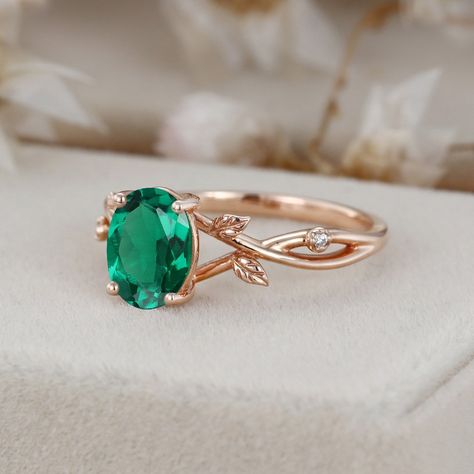 Elevate your love with our Oval Cut Lab Emerald Engagement Leaf Ring in 14K Rose Gold. This exquisite ring features a mesmerizing lab-created emerald, gracefully set in a rose gold leaf-inspired band. Emerald Ring For Women, Emerald Ring Designs For Women, Rose Gold Promise Ring, Gold Promise Ring, Emerald Rings, Leaf Engagement Ring, Emerald Ring Gold, Gold Promise Rings, Fairy Princess