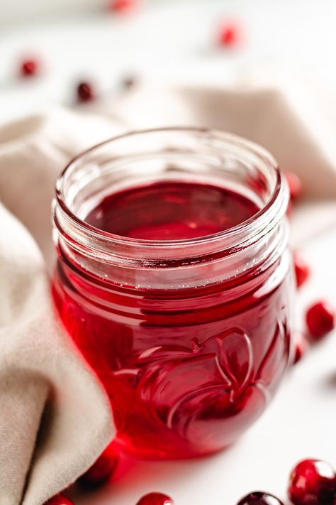 This tart, tangy, and sweet Cranberry Simple Syrup adds a ton of cranberry flavor to any dish. Use it in cocktails, salad dressings, and plenty of sweet treats! This simple syrup is perfect for adding a little winter flavor in any drink or festive dish all season long! Cranberry Syrup Recipe, Homemade Simple Syrup, Cranberry Simple Syrup, Iced White Chocolate Mocha, Strawberry Simple Syrup, Cinnamon Simple Syrup, Cranberry Cinnamon, Ginger Lemonade, Drink Syrups