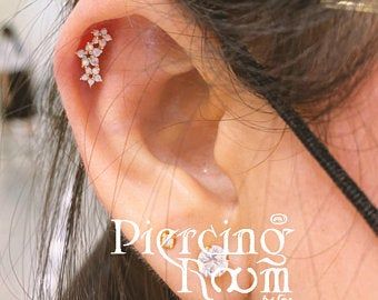 Titanium curve gem conch earring | Etsy Cartilage Helix Piercing, Ear Piercings Tragus, Silver Casting, Helix Piercing Jewelry, Cool Ear Piercings, Cartilage Jewelry, Conch Earring, Flower Garland, Helix Earrings