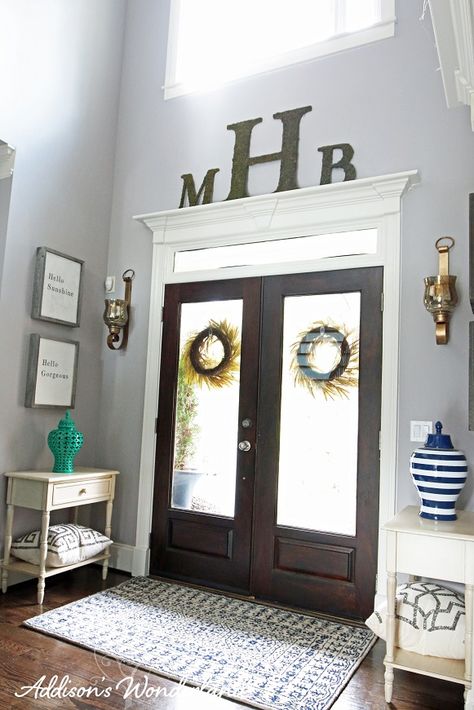 Tips for creating and accessorizing your dream entryway foyer with gray walls, dark hardwood flooring and bold pops of color! High Ceiling Entry Way Wall Decor, Door Frame Decor, Inside Front Door Decor Entryway, Doorway Decor, Hardwood Floors Dark, Wooden Front Doors, Foyer Decor, Foyer Decorating, Décor Diy